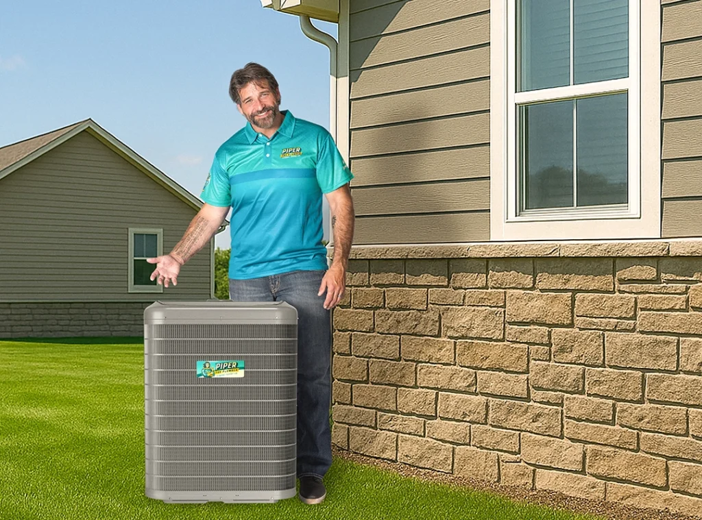 air conditioner installation technician working on outdoor condenser unit in red deer home